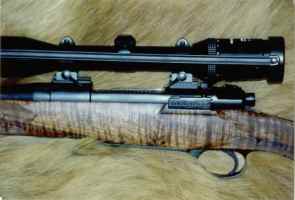 25.06 Mauser action squared bridged with fiddle back clarol walnut stock