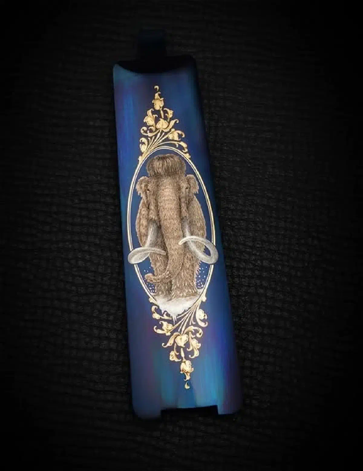 Gold inlaid engraved mammoth